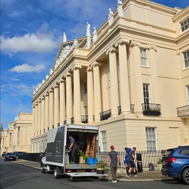 The Removal Group crew loading a Luton van at a period London terrace